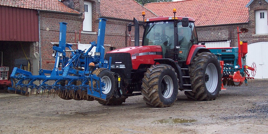 Weight distribution using a front implement to compensate for the weight at the rear
